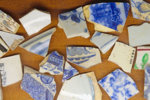 Broken pieces of pottery on table