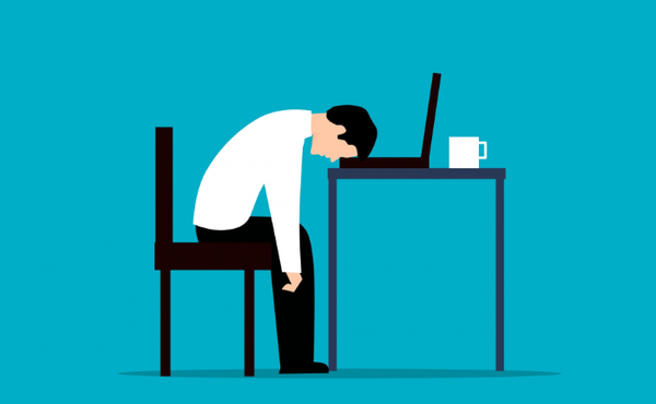 Image of person with head on table